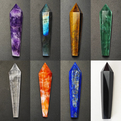 Collection of various crystal points on a gray background