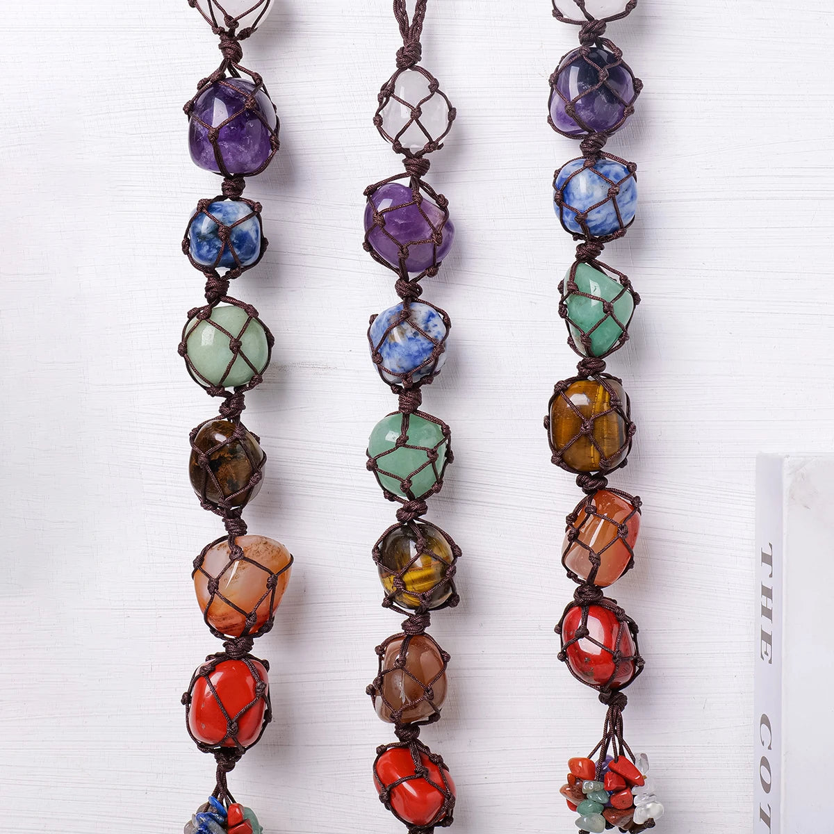 Colorful beaded necklaces on a white background