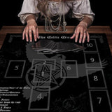 Person with tarot cards on a Celtic Cross mat