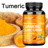 Turmeric supplement bottle with turmeric roots and powder on a white background