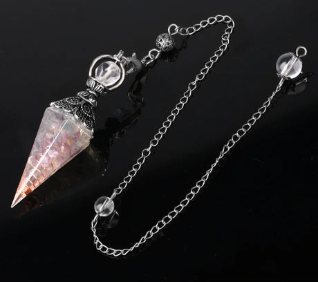 Crystal pendulum with chain on a black background, branded 'Cala Jewelry'.