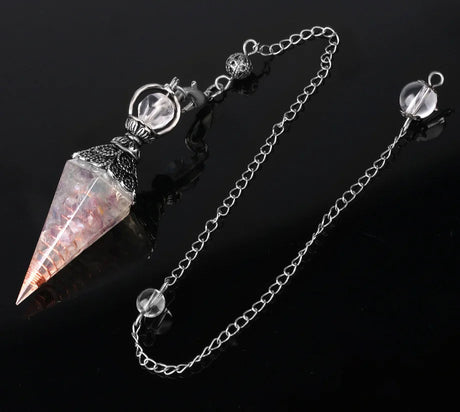 Crystal pendulum with chain on a black background, branded 'Cala Jewelry'.