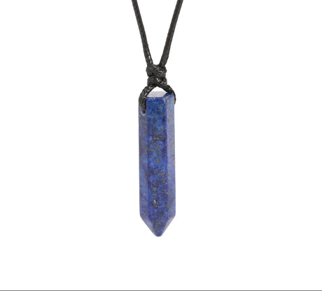 Blue crystal pendant on a black cord against a white background