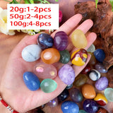 Hand holding colorful marbles with weight and quantity information displayed.