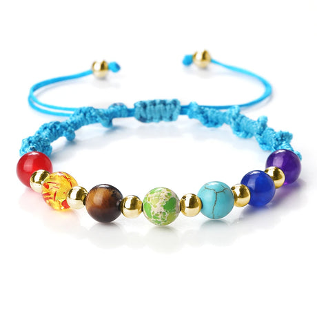 Colorful beaded bracelet with blue cord on a white background