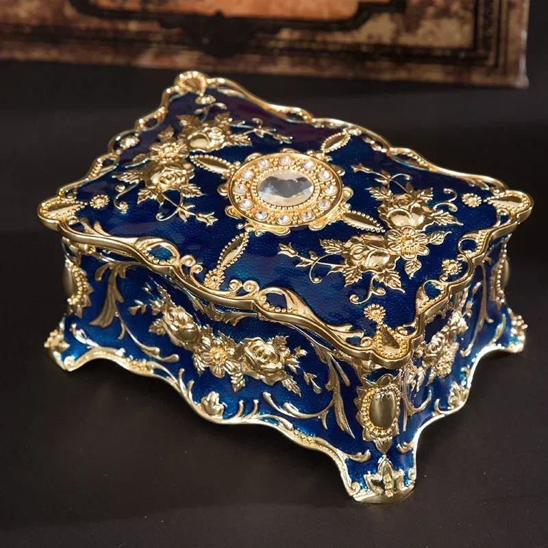 Decorative blue box with gold embellishments on a dark background