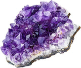 Amethyst crystal cluster on a white background