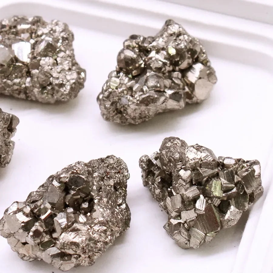 Close-up of pyrite crystals on a white background