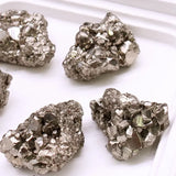 Close-up of pyrite crystals on a white background