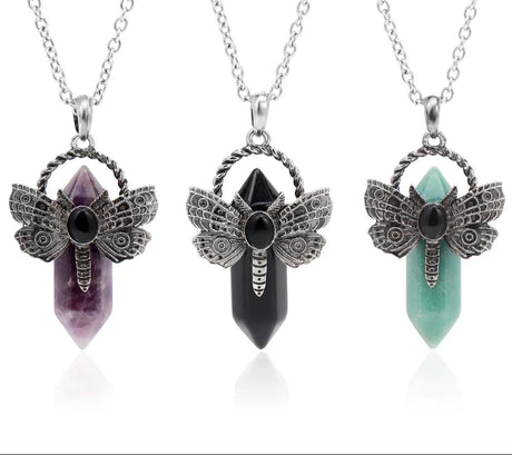 Three crystal pendants with butterfly designs on a white background