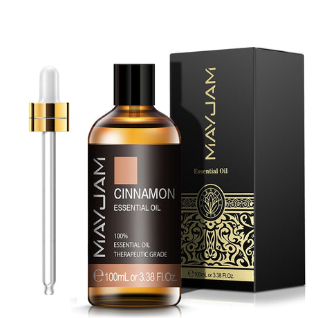 MayJam Cinnamon Essential Oil bottle with dropper and packaging on a white background