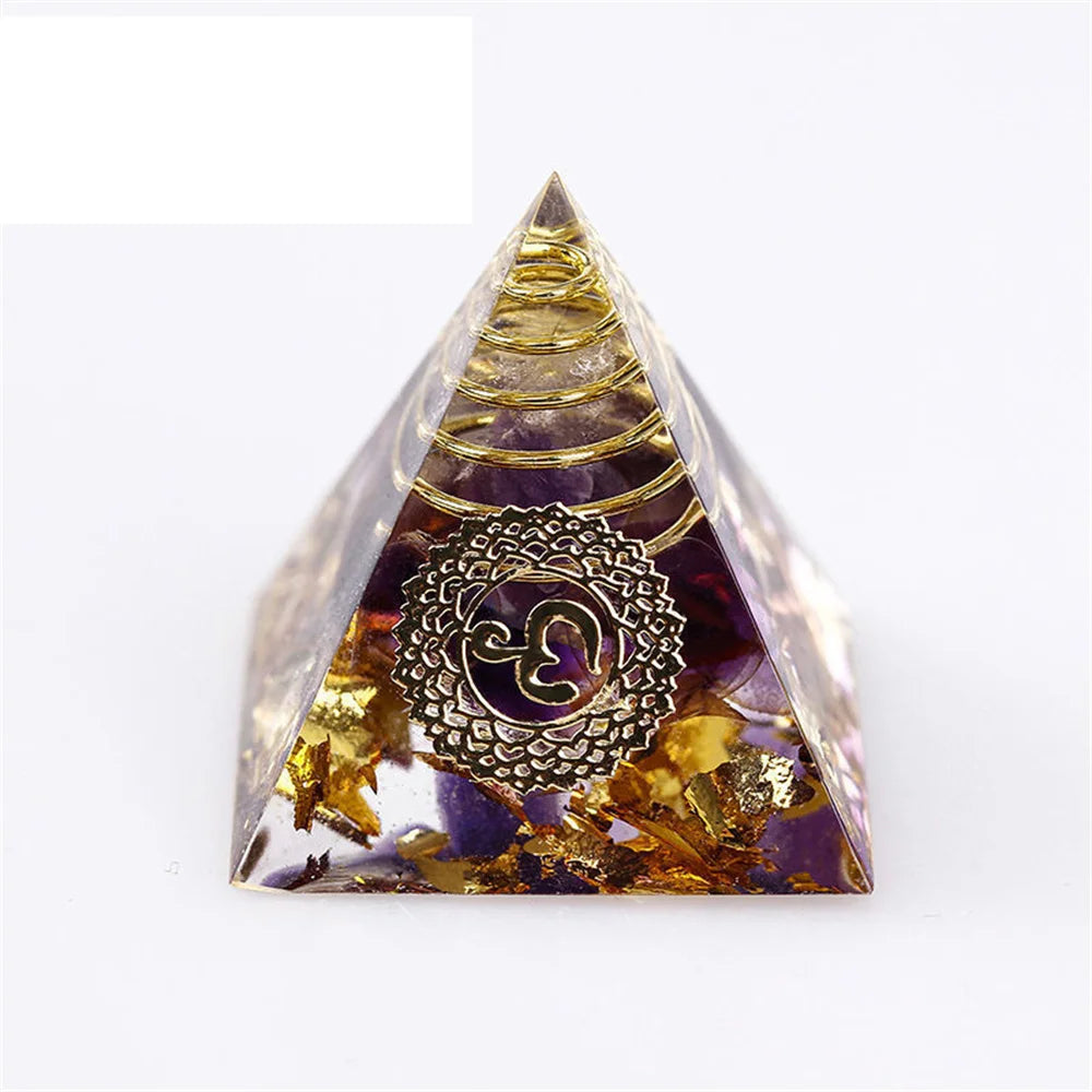Pyramid-shaped object with a decorative emblem on a white background