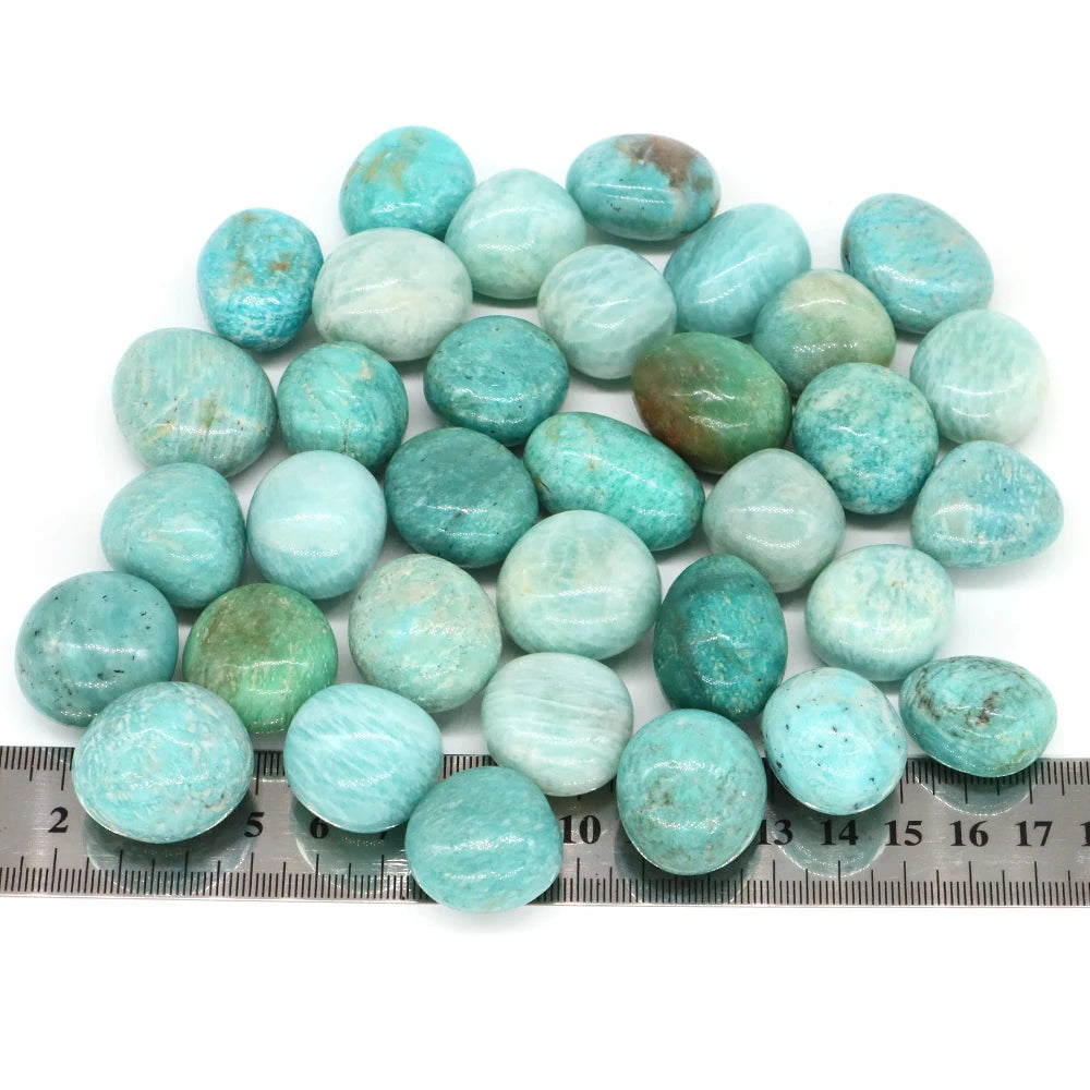 Turquoise stones on a ruler for size reference