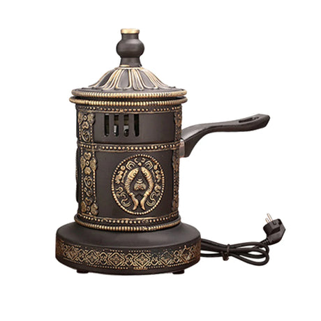 Decorative electric coffee maker with intricate designs on a white background