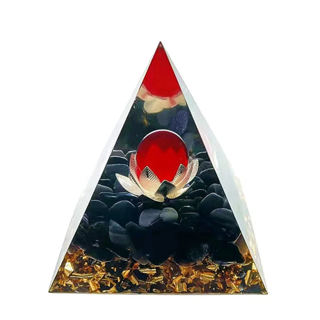 Triangular decorative item with red center, black and gold elements on a white background