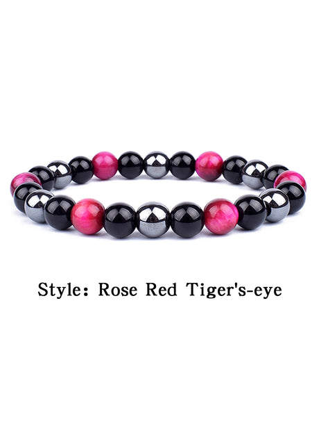 Beaded bracelet with rose red and black beads on a white background