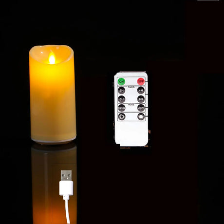 Flickering candle light with a remote control on a black background