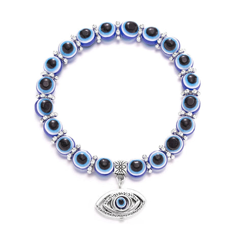 Bracelet with blue and black eye-shaped beads on a white background
