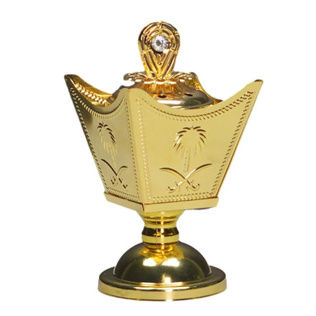 Gold decorative item with intricate designs on a white background
