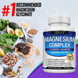 Bottle of magnesium complex supplement with health benefits listed, surrounded by healthy foods on a light background.