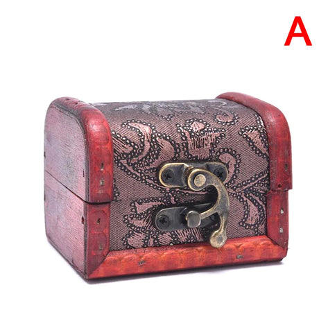 Decorative wooden box with intricate patterns and a brass lock on a white background