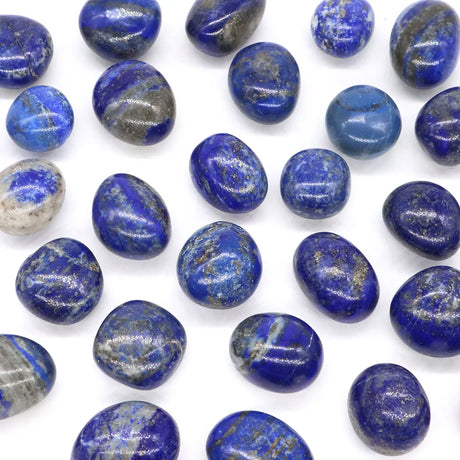 Collection of blue and gray marbled stones on a white background