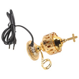 Gold incense burner with black power cord on a white background