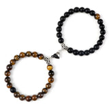 Bracelet with black and brown beaded design on a white background