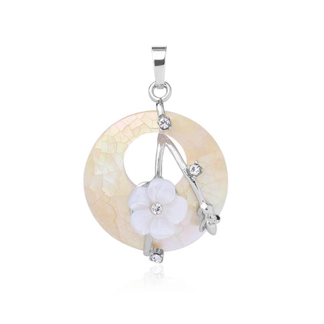 Jewelry pendant with circular design and white stones on a white background