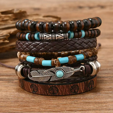 Stack of leather and beaded bracelets on a wooden surface