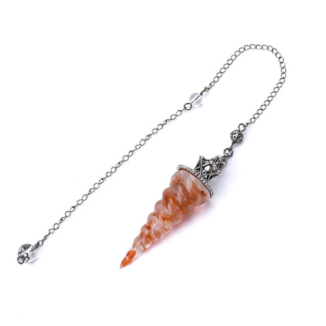 Decorative item with a chain and orange stone on a white background