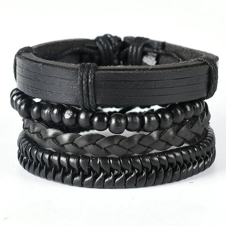 Stack of black leather bracelets on a white background