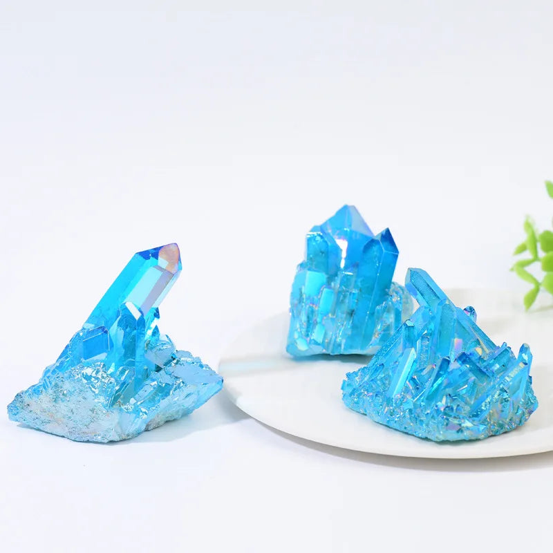 Blue crystal-like objects on a white plate with a light gray background