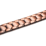 Rose gold bracelet with a honeycomb pattern on a white background