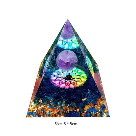 Triangular crystal orgone pyramid with colorful interior and size indication on a white background