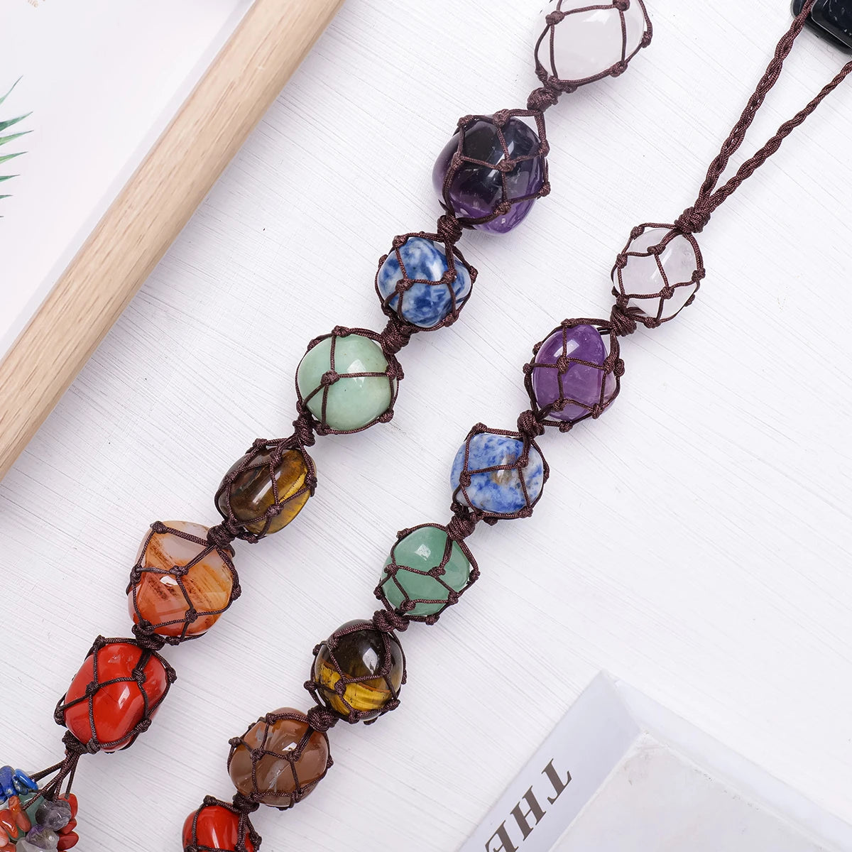 Necklace with colorful beads on a white surface
