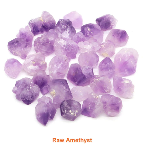 Raw amethyst crystals on a white background