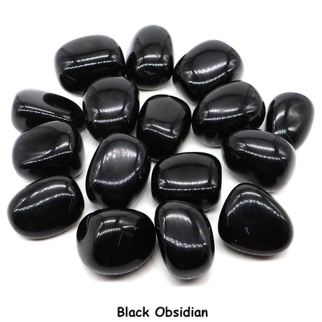 Collection of black obsidian stones on a white background