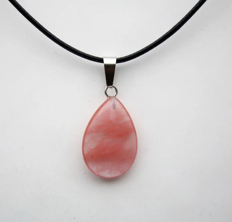 Necklace with a pink teardrop pendant on a white background