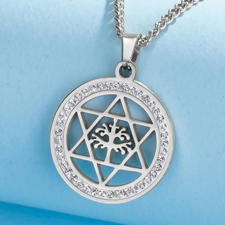 Silver pendant with geometric design on a blue background