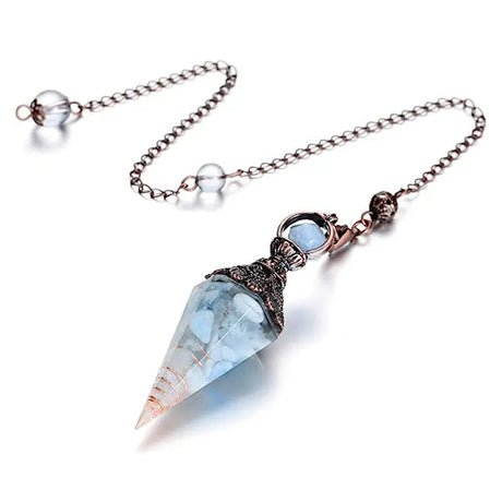 Crystal pendulum with chain on a white background