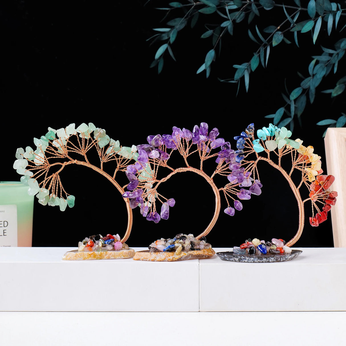 Decorative headbands with colorful stones on a white surface with a black background