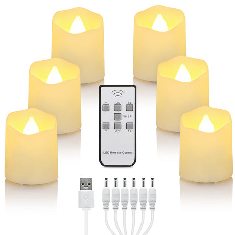 Set of LED candles with remote control and accessories on a white background