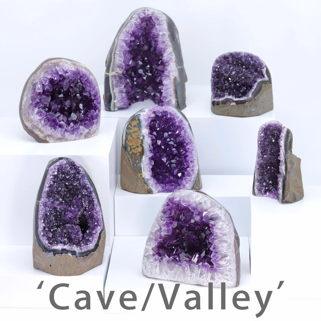 Collection of purple crystal geodes on a white background with 'Cave/Valley' branding.