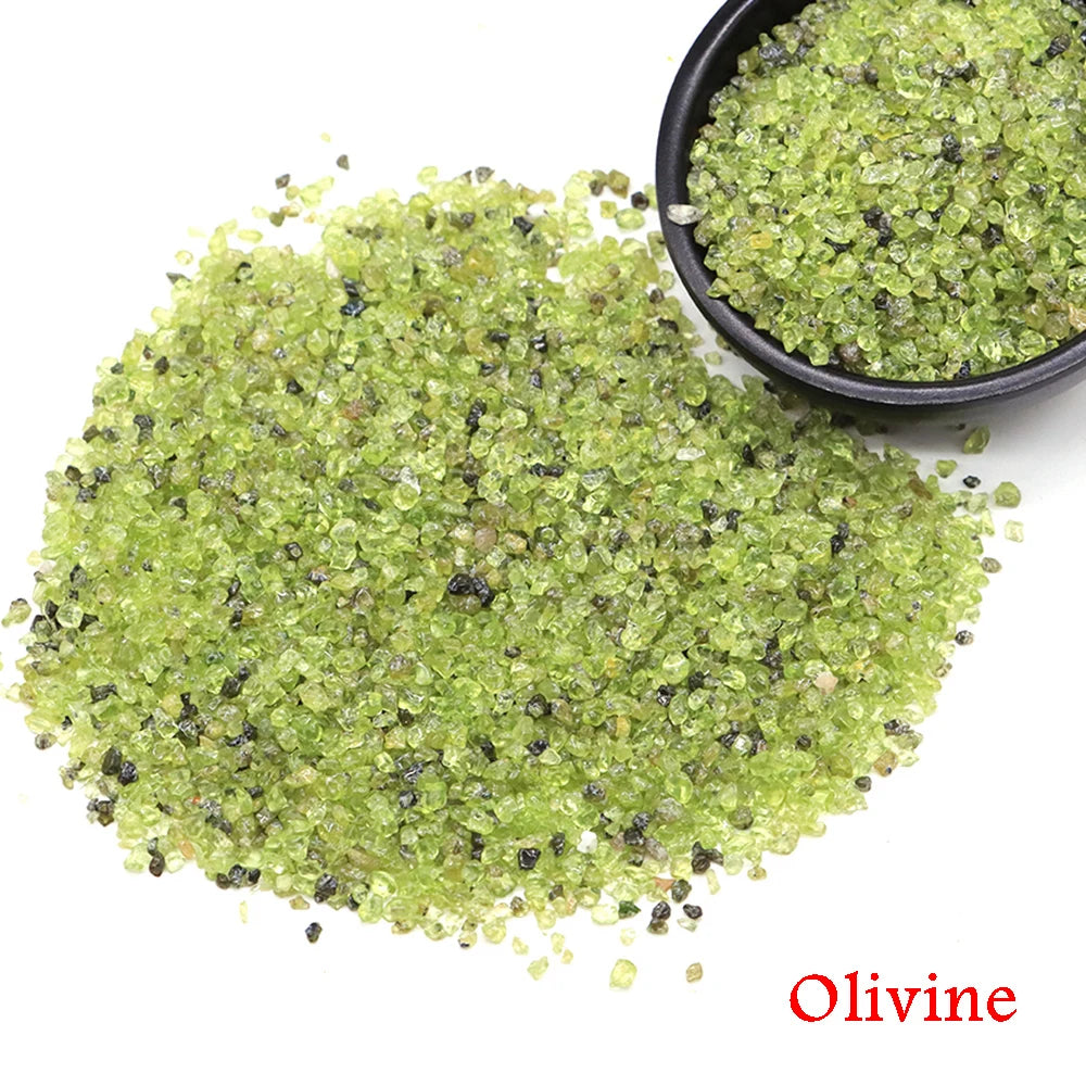 Olivine stones with a bowl of stones on a white background.