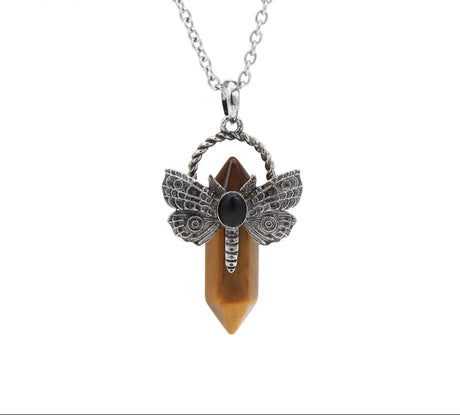 Dragonfly pendant necklace with a crystal on a white background, featuring the Czia Jewelry logo.