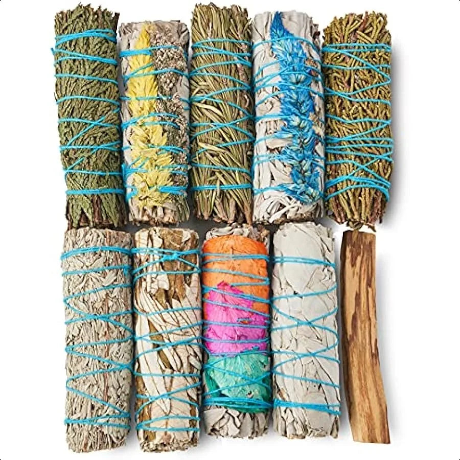 Collection of smudge sticks with a wooden tool on a white background