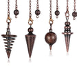 Set of four metallic pendulums on chains against a white background