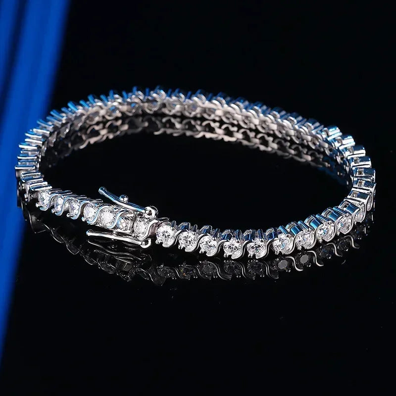 Silver bracelet with clear stones on a black background