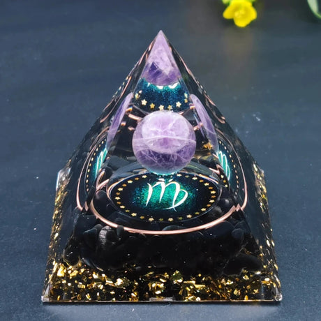 Crystal pyramid with purple sphere and astrological symbol on a dark background